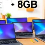 Vários notebooks modernos em uma mesa de estudo.