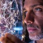 Cientistas olhando reflexo vida sintética.